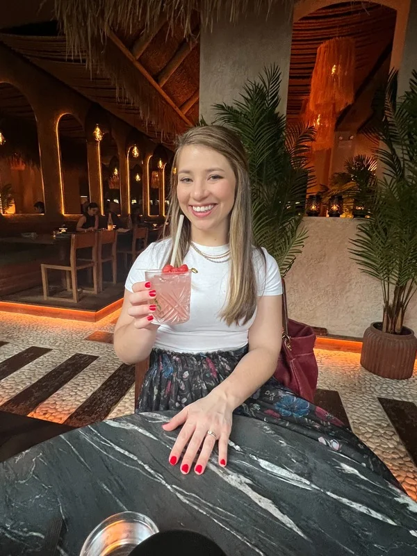 Allyson Klingensmith seated at a restaurant table