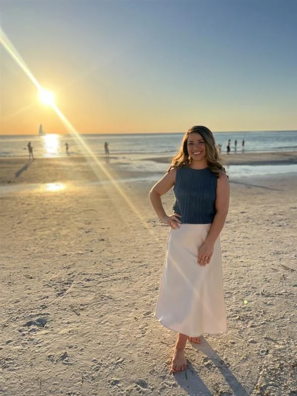 Allyson Klingensmith on the shoreline at sunset